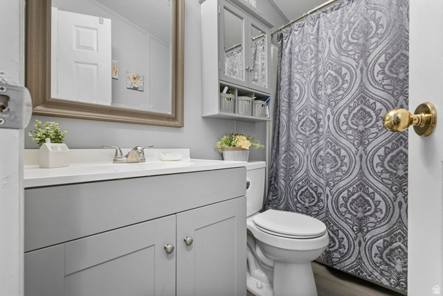 271 Mindella Way Layton, UT 84041 - Photo 19 of 27 Bathroom featuring a single vanity with light grey cabinetry, a white countertop, and a brushed nickel faucet