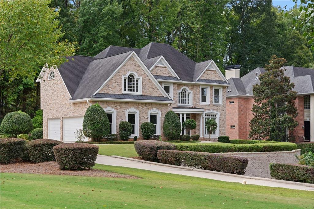 475 Carriage Gate Southwest Atlanta, GA 30331 - Photo 1 of 1 a front view of a house with a yard