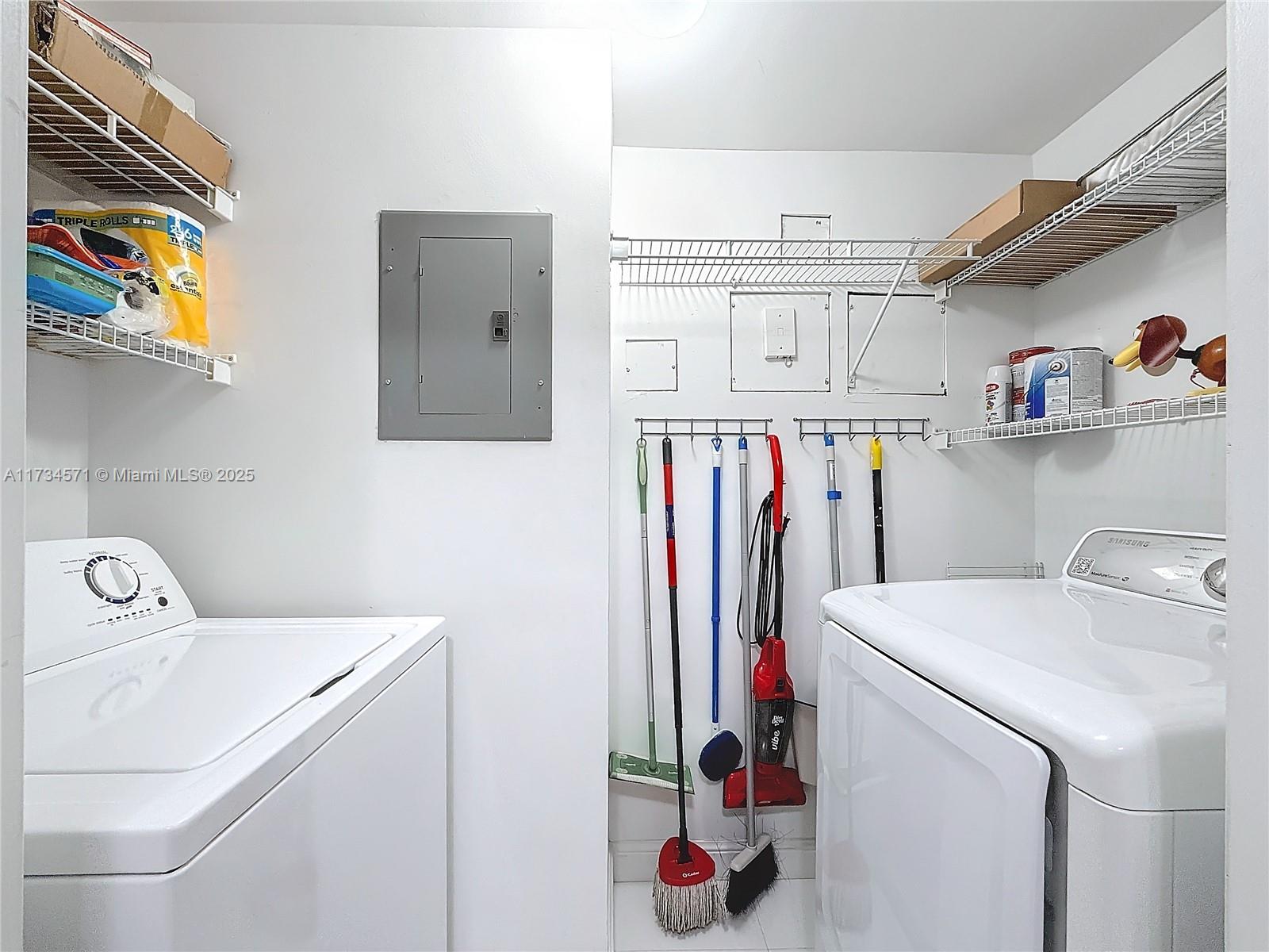 9172 Collins Avenue, Unit 414 Surfside, FL 33154 - Photo 14 of 23 a utility room with dryer and washer