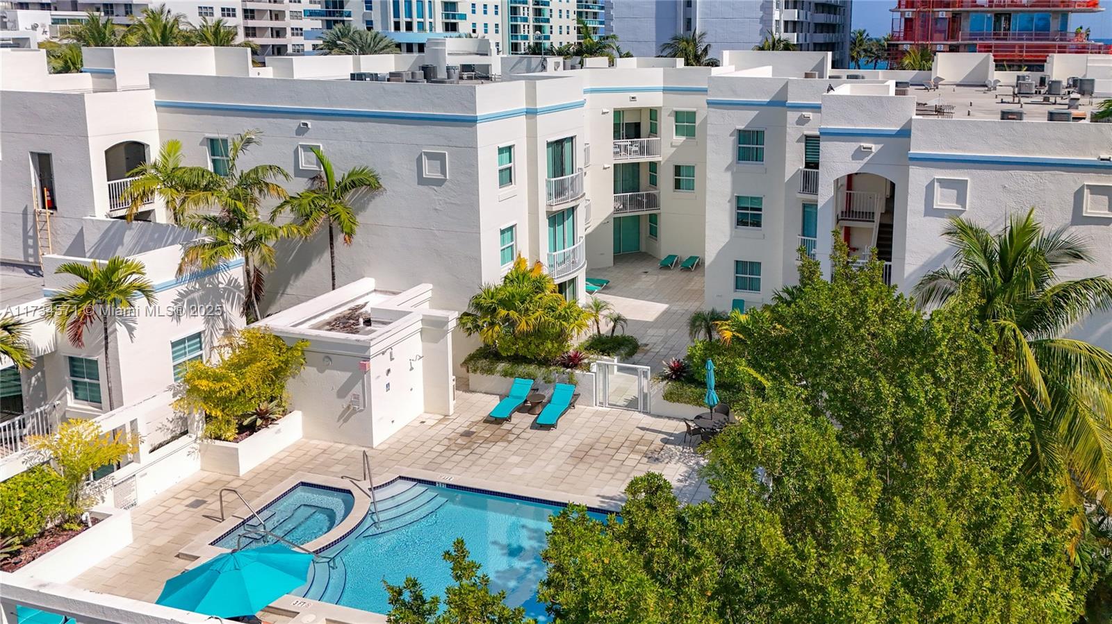 9172 Collins Avenue, Unit 414 Surfside, FL 33154 - Photo 23 of 23 a building with potted plants in front of it