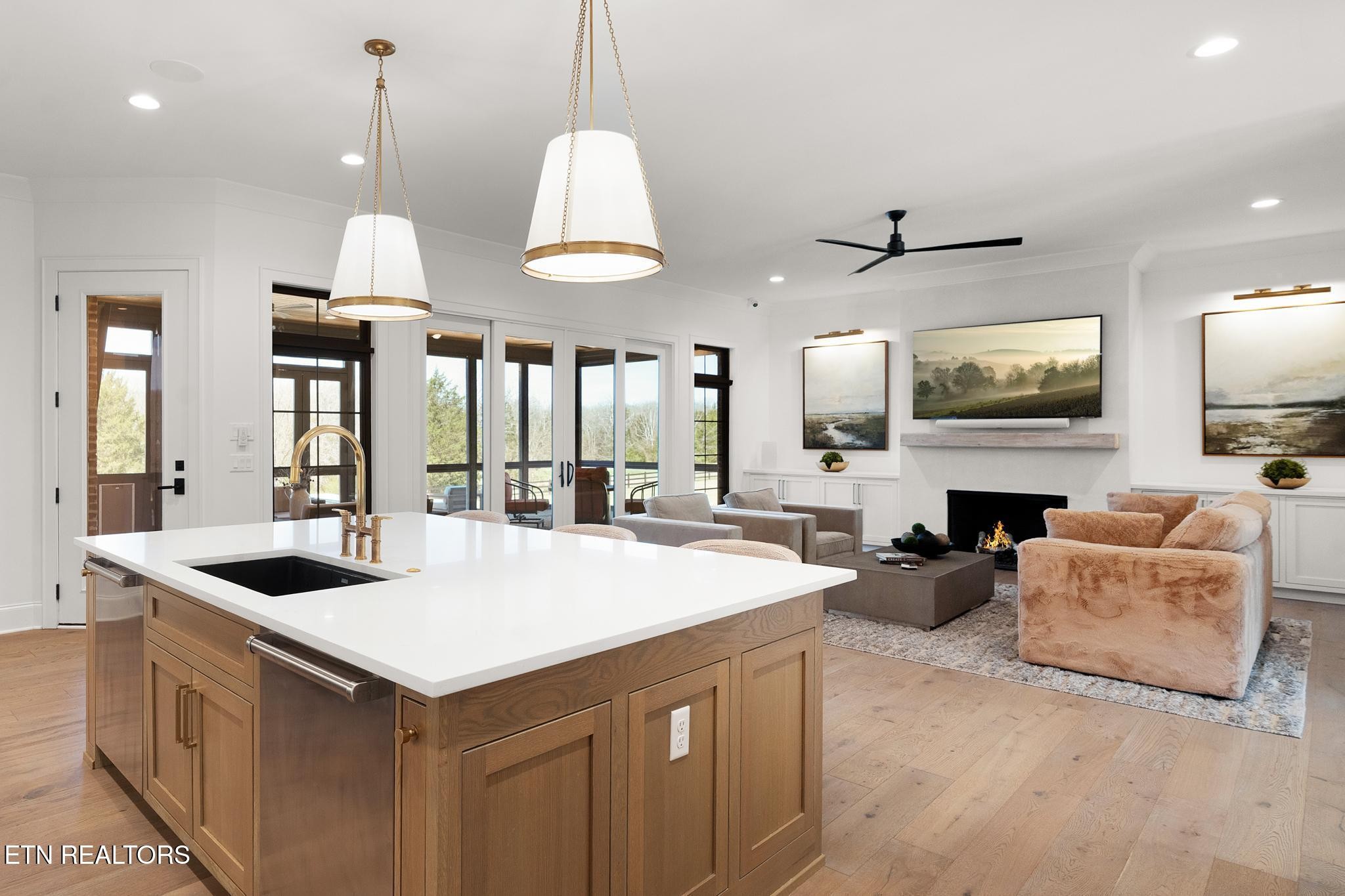 3693 Herschel Hudson Road Lascassas, TN 37085 - Photo 13 of 51 a large kitchen with stainless steel appliances a stove a center island and a wooden floor