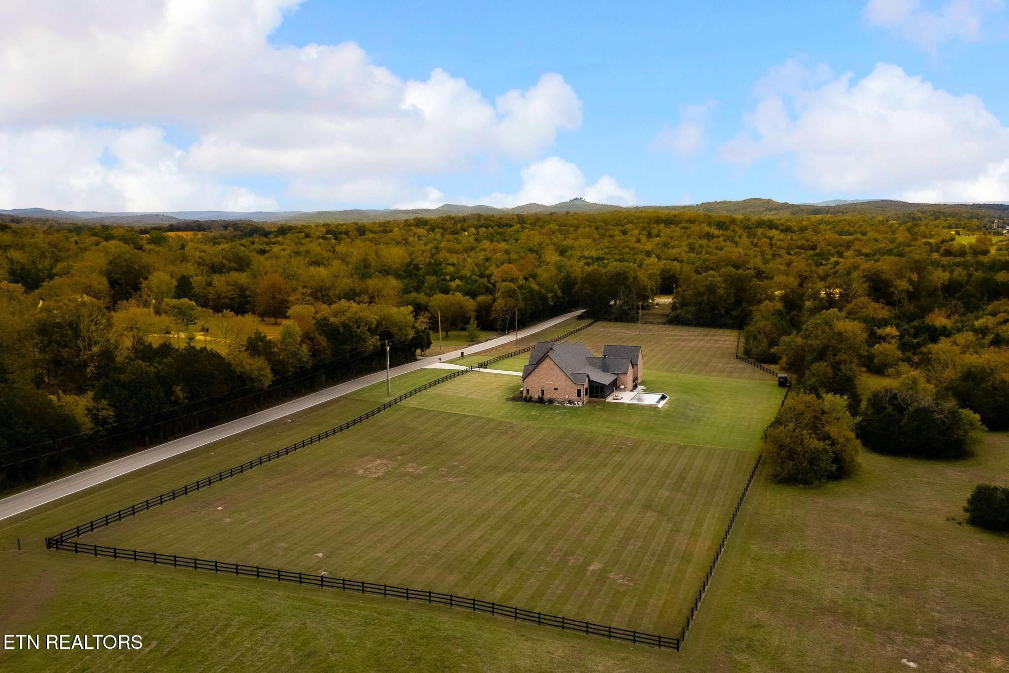 3693 Herschel Hudson Road Lascassas, TN 37085 - Photo 4 of 51 a view of a swimming pool with an outdoor seating and mountain view