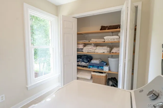 a kitchen with a window a sink and a refrigerator