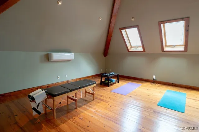 a backyard of a house with wooden floor and pool table