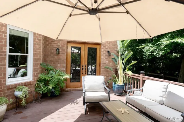 a view of a patio with couches and potted plants