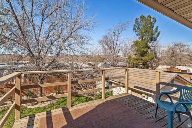 892 Cambridge Drive St. George, UT 84770 - Photo 53 of 65 Expansive wood-finish deck with a wood-finish railing system