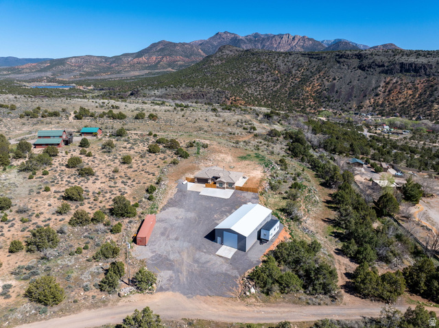 62 North Lucky 7 Road Veyo, UT 84782 - Photo 32 of 43 Aerial view of sparsely populated area with mountains and a desert landscape