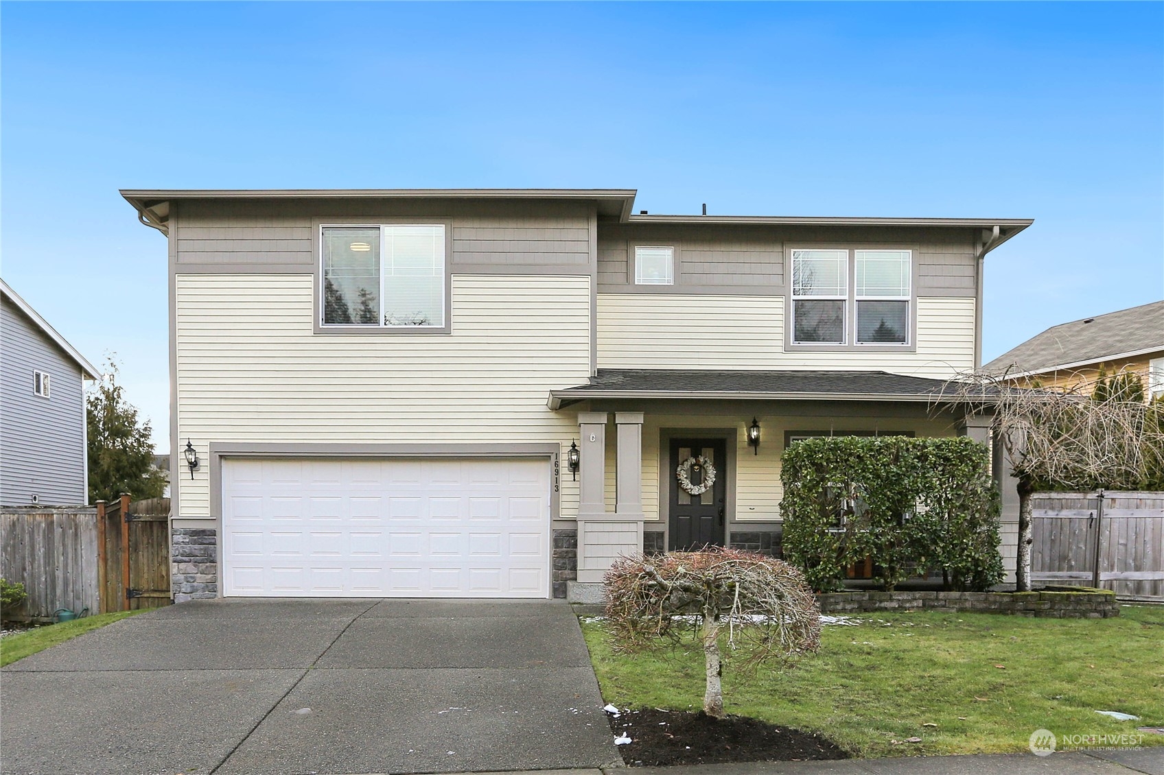 16913 Southeast 180th Place Renton, WA 98058 - Photo 1 of 35 a front view of a house with garden