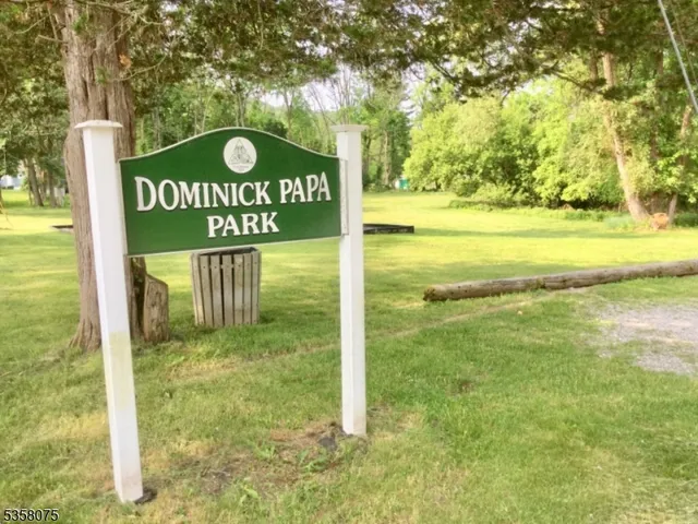 a view of a park with swings and slides