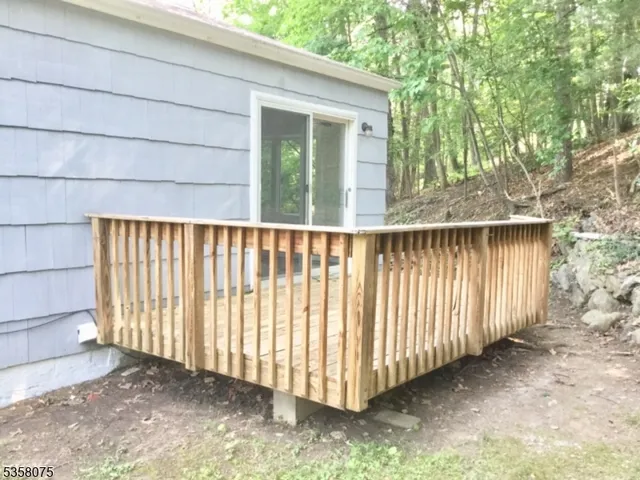 a view of a backyard with pathway