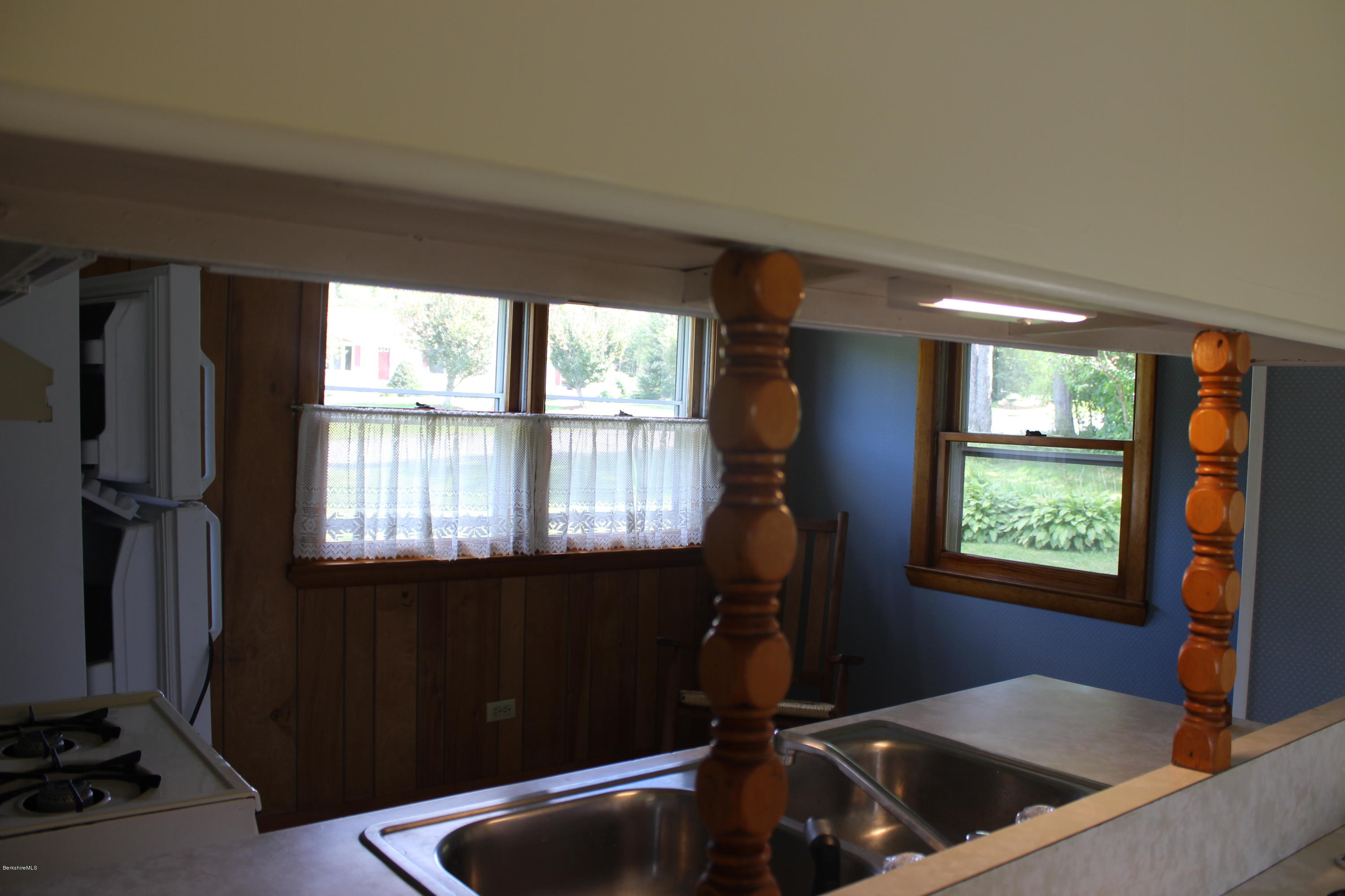 140 Windsor Road Savoy, MA 01256 - Photo 11 of 16 a kitchen with a sink a window and cabinets