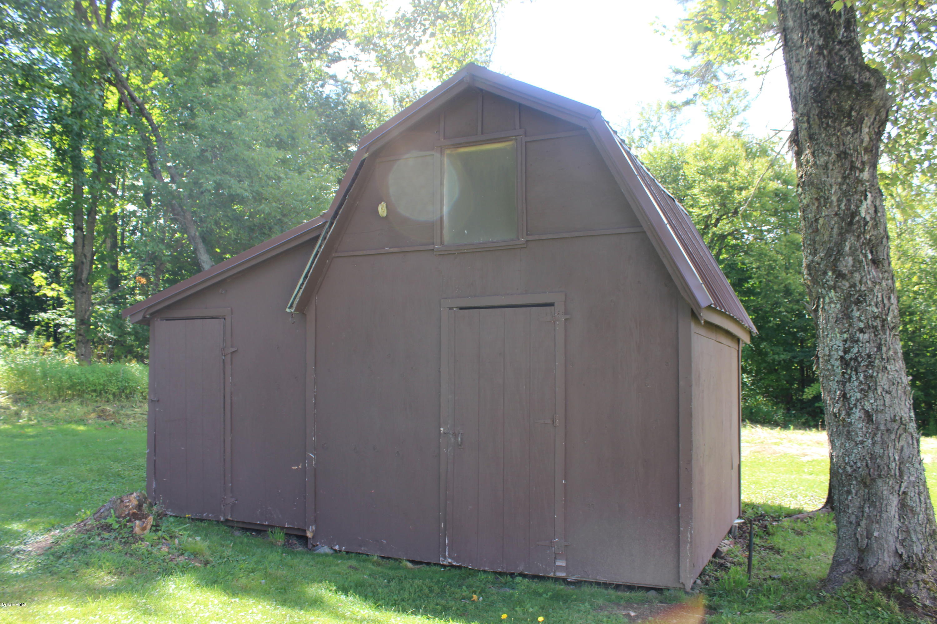 140 Windsor Road Savoy, MA 01256 - Photo 14 of 16 a house with trees in the background