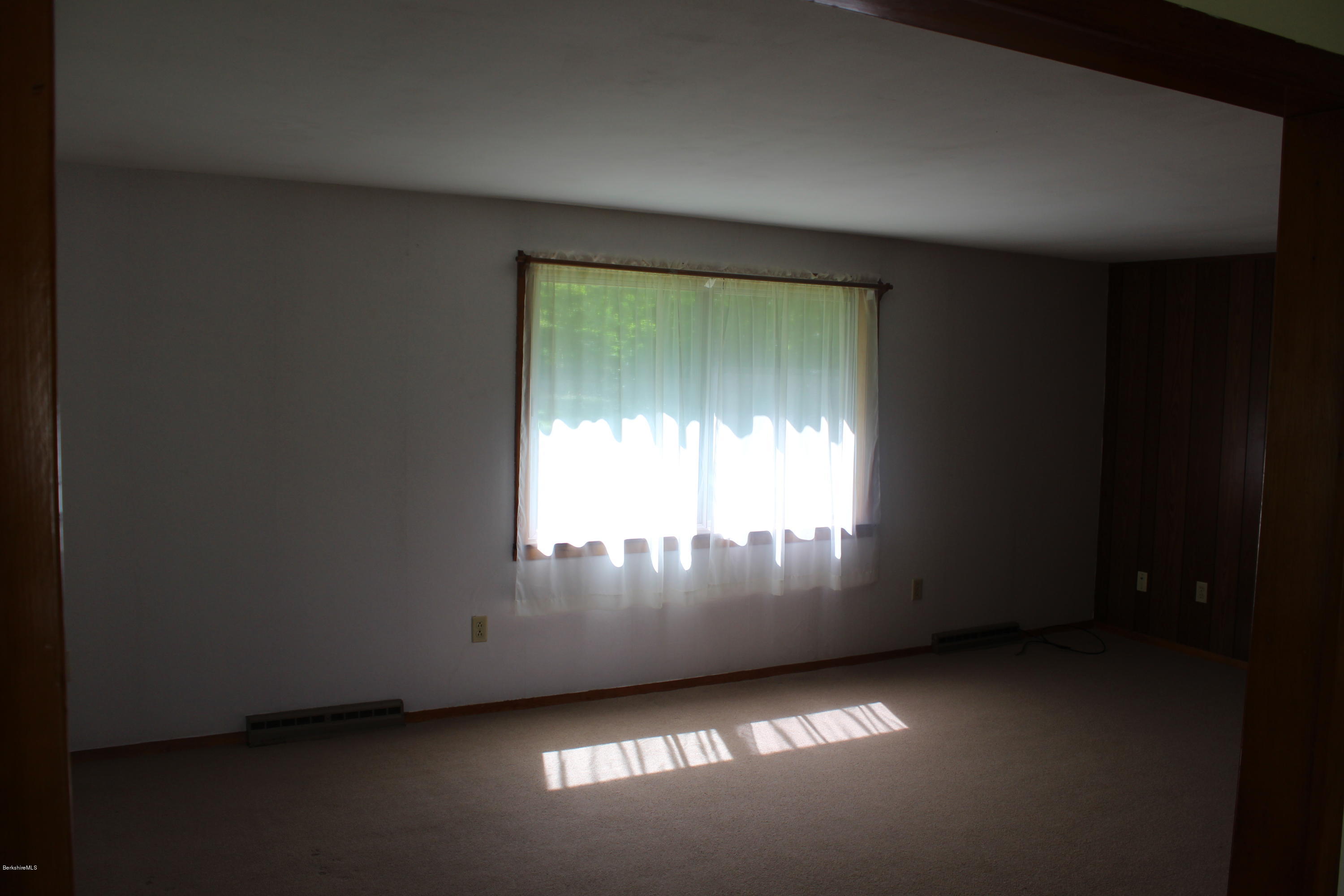 140 Windsor Road Savoy, MA 01256 - Photo 5 of 16 a view of an empty room and window
