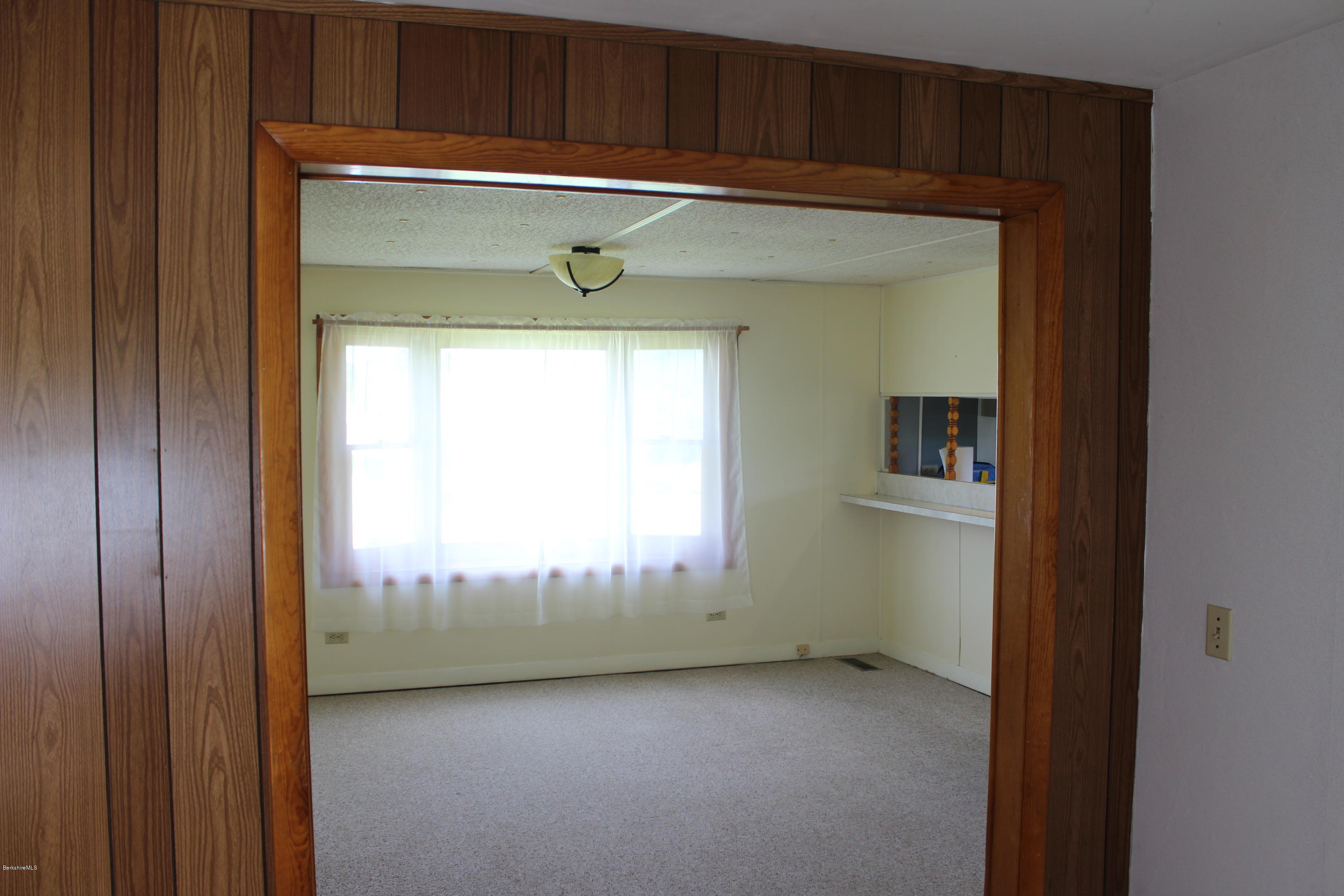 140 Windsor Road Savoy, MA 01256 - Photo 6 of 16 a view of an empty room and a window