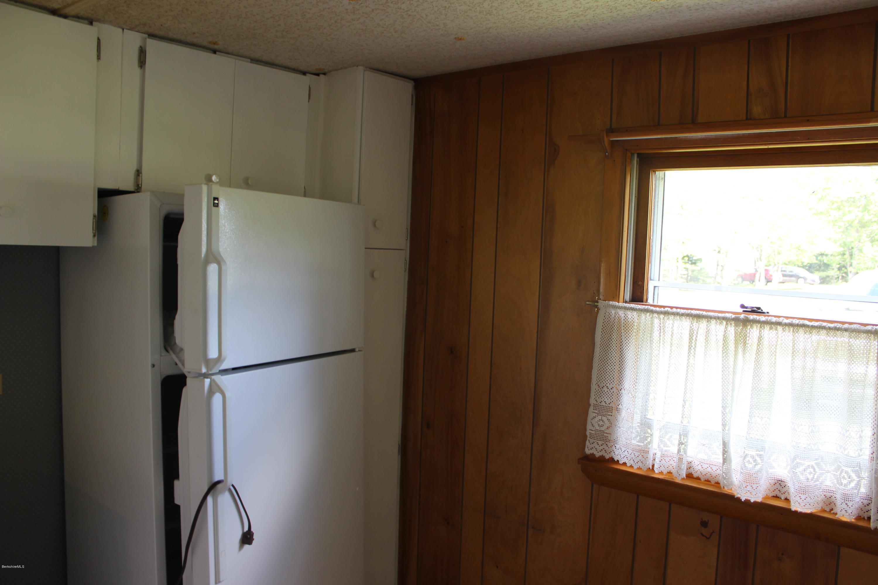 140 Windsor Road Savoy, MA 01256 - Photo 10 of 16 a white refrigerator freezer sitting in a kitchen