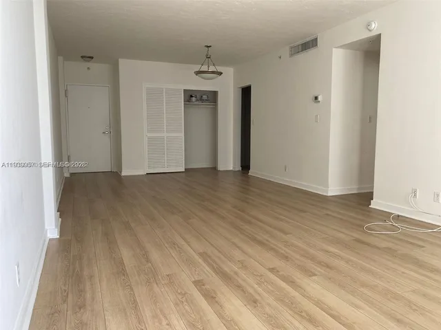 a view of a livingroom with wooden floor