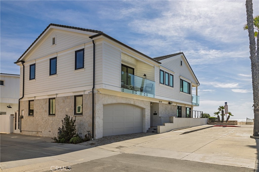 6110 West Oceanfront Newport Beach, CA 92663 - Photo 2 of 33 a view of a house with a street