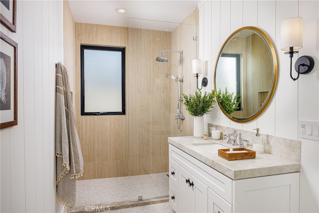 6110 West Oceanfront Newport Beach, CA 92663 - Photo 21 of 33 a bathroom with a sink and a mirror