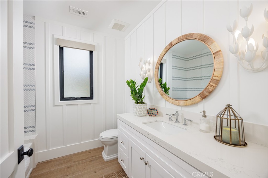 6110 West Oceanfront Newport Beach, CA 92663 - Photo 23 of 33 a bathroom with a sink and a mirror