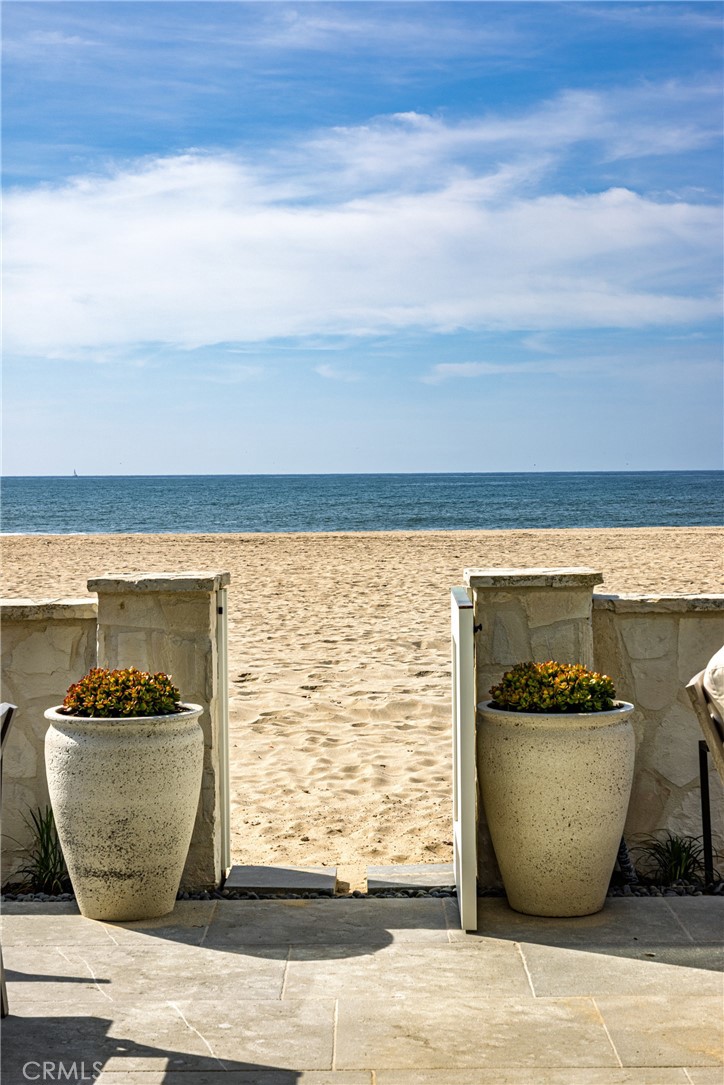 6110 West Oceanfront Newport Beach, CA 92663 - Photo 29 of 33 a view of a glass room with wooden floor