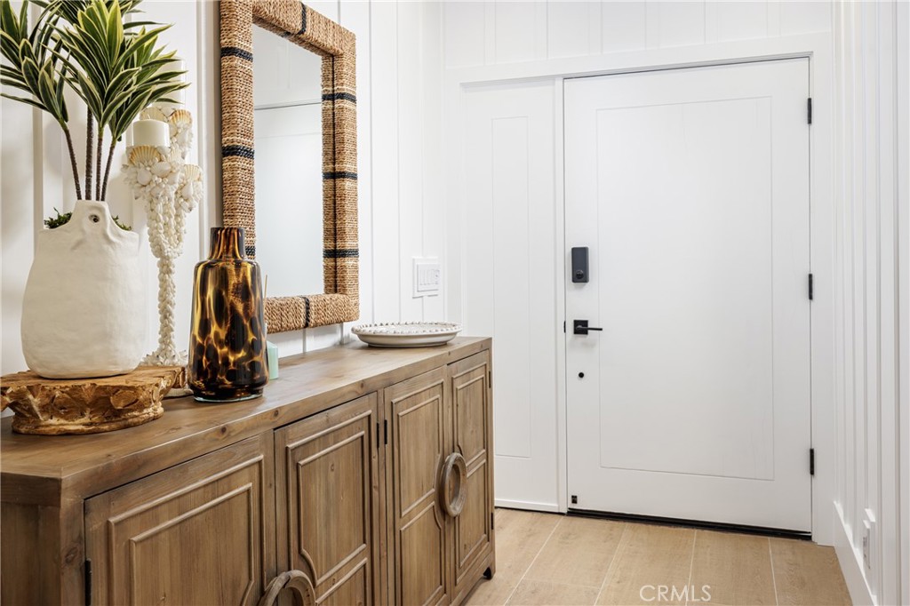 6110 West Oceanfront Newport Beach, CA 92663 - Photo 4 of 33 a view of a bathroom with a sink and a mirror