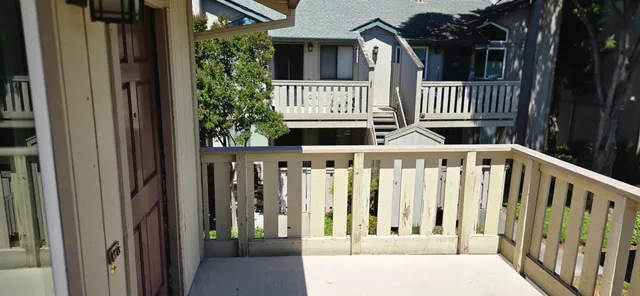 a view of a backyard with swimming pool