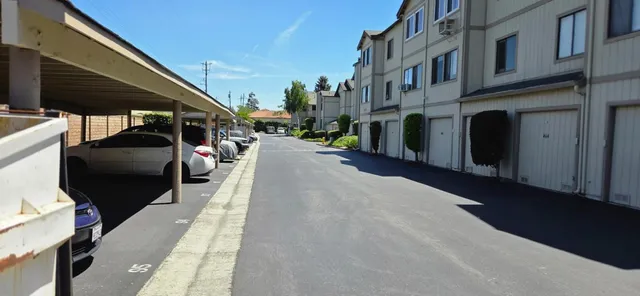 a view of a street with seating area