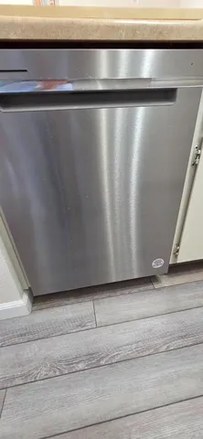 a stove top oven sitting inside of a kitchen