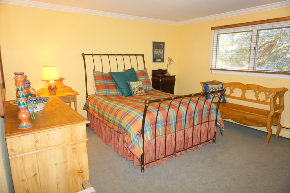 42265 Piburn Flats Road Crawford, CO 81415 - Photo 11 of 35 a bed room with a bed and a chair