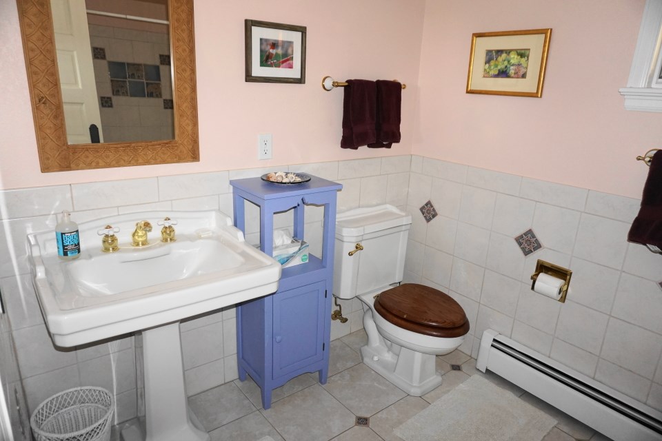 42265 Piburn Flats Road Crawford, CO 81415 - Photo 13 of 35 a bathroom with a sink toilet and a mirror