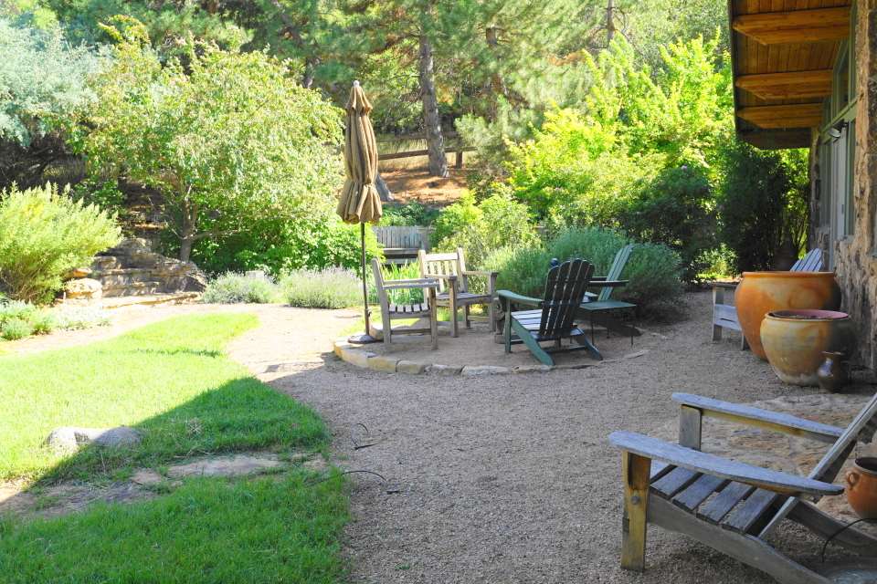 42265 Piburn Flats Road Crawford, CO 81415 - Photo 15 of 35 a backyard of a house with table and chairs
