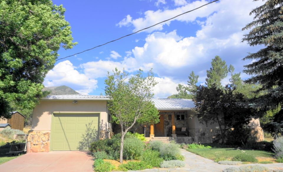 42265 Piburn Flats Road Crawford, CO 81415 - Photo 2 of 35 a view of a house with a yard