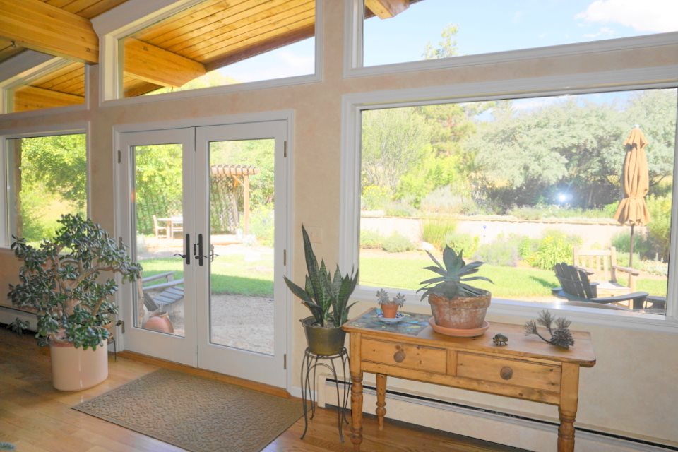 42265 Piburn Flats Road Crawford, CO 81415 - Photo 5 of 35 a view of a living room with furniture and a potted plant