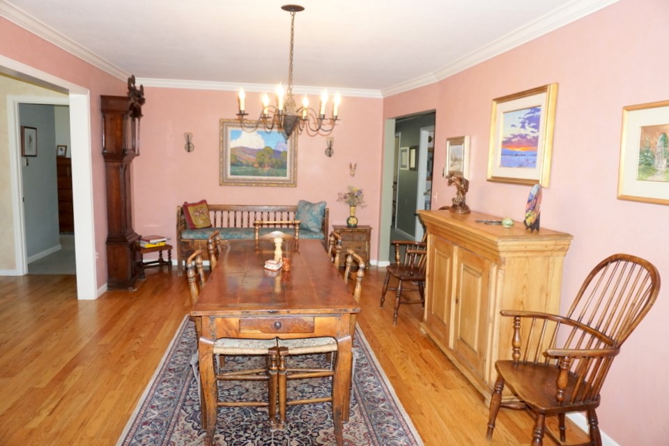 42265 Piburn Flats Road Crawford, CO 81415 - Photo 8 of 35 a dining room with furniture a chandelier and wooden floor