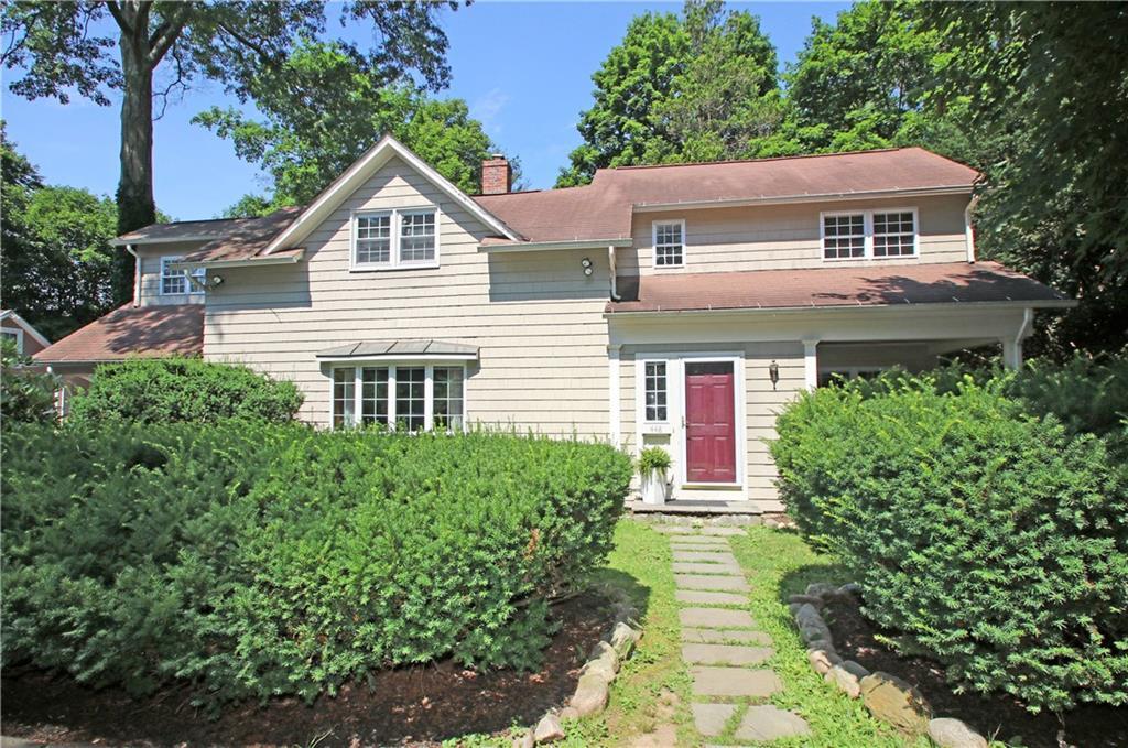 448 Riverside Avenue Westport, CT 06880 - Photo 1 of 1 a front view of a house with a yard