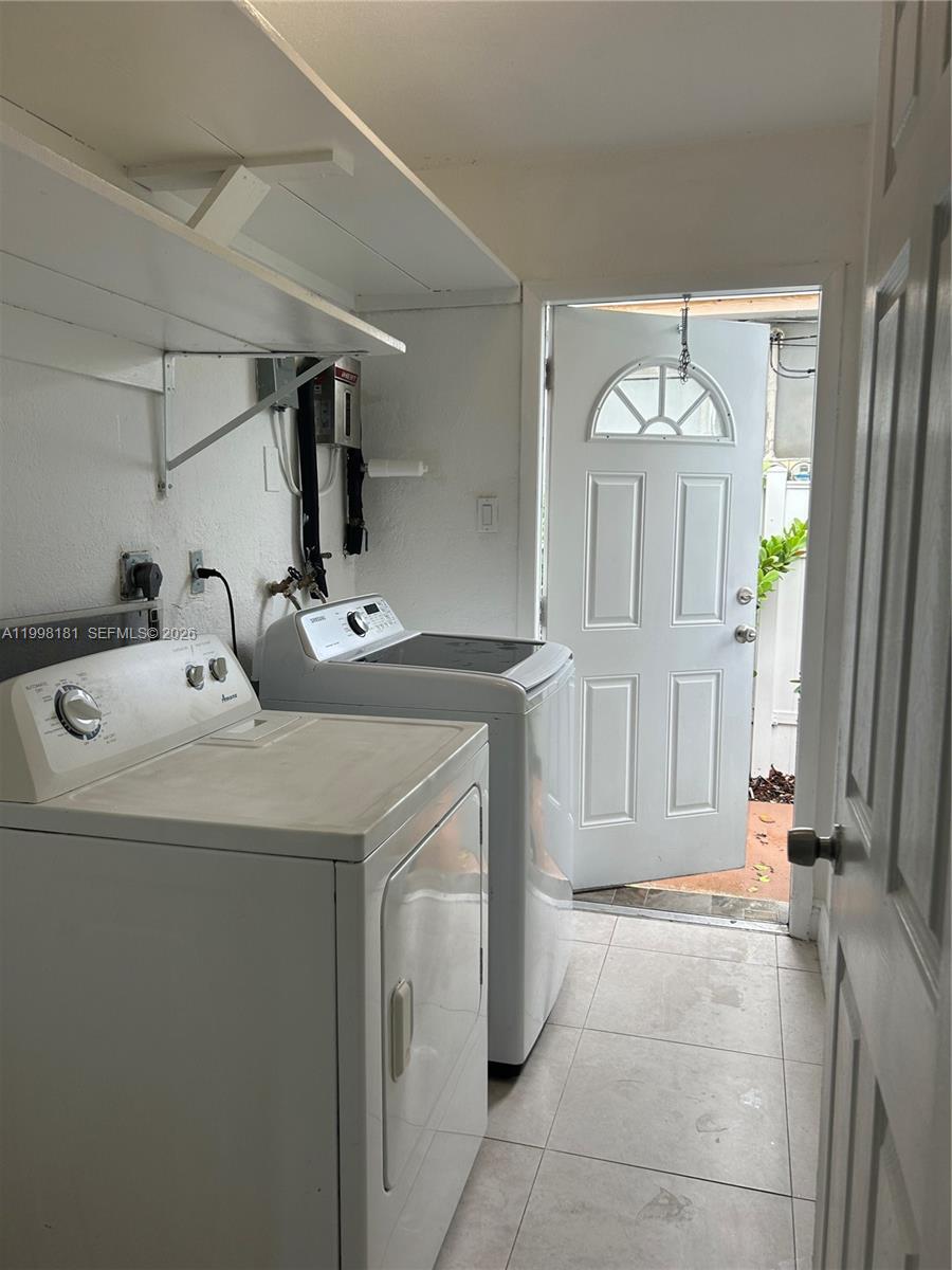 2804 Southwest 35th Avenue, Unit 2804 Miami, FL 33133 - Photo 15 of 22 a bathroom with a sink and a mirror