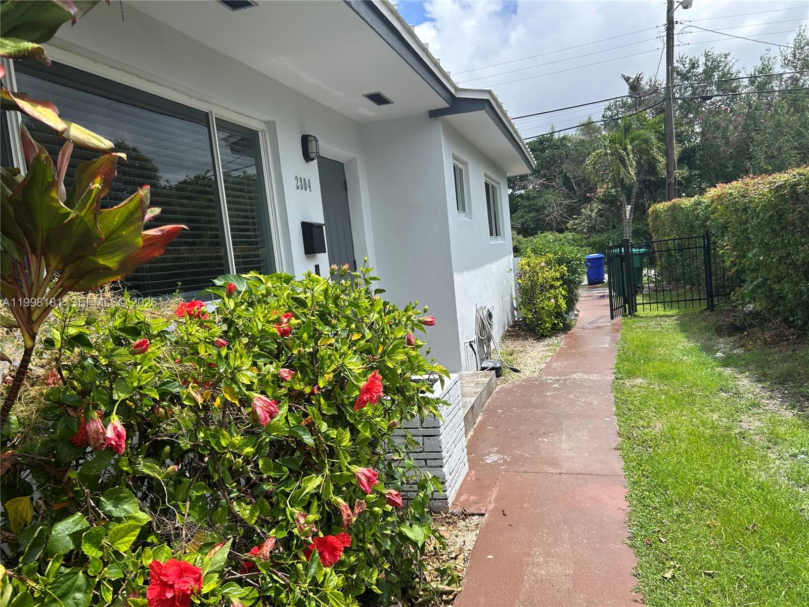 2804 Southwest 35th Avenue, Unit 2804 Miami, FL 33133 - Photo 18 of 22 a flower plants sitting in front of house