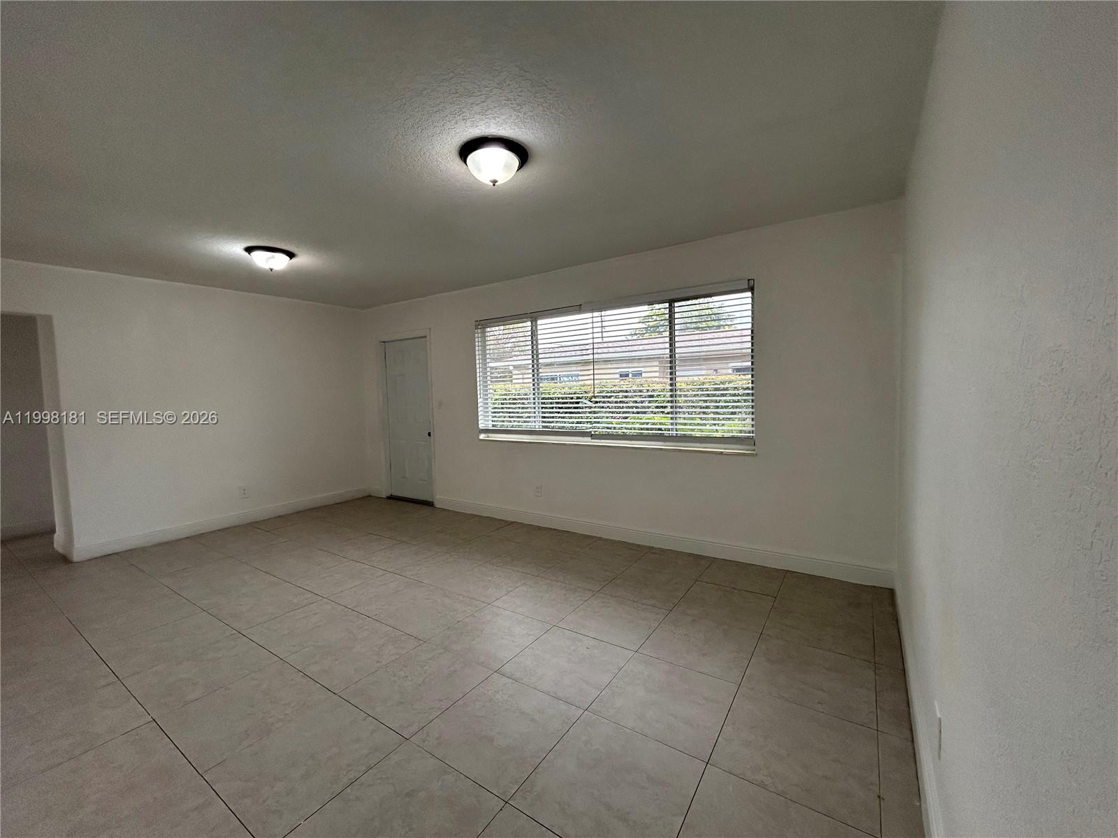 2804 Southwest 35th Avenue, Unit 2804 Miami, FL 33133 - Photo 2 of 22 an empty room with windows
