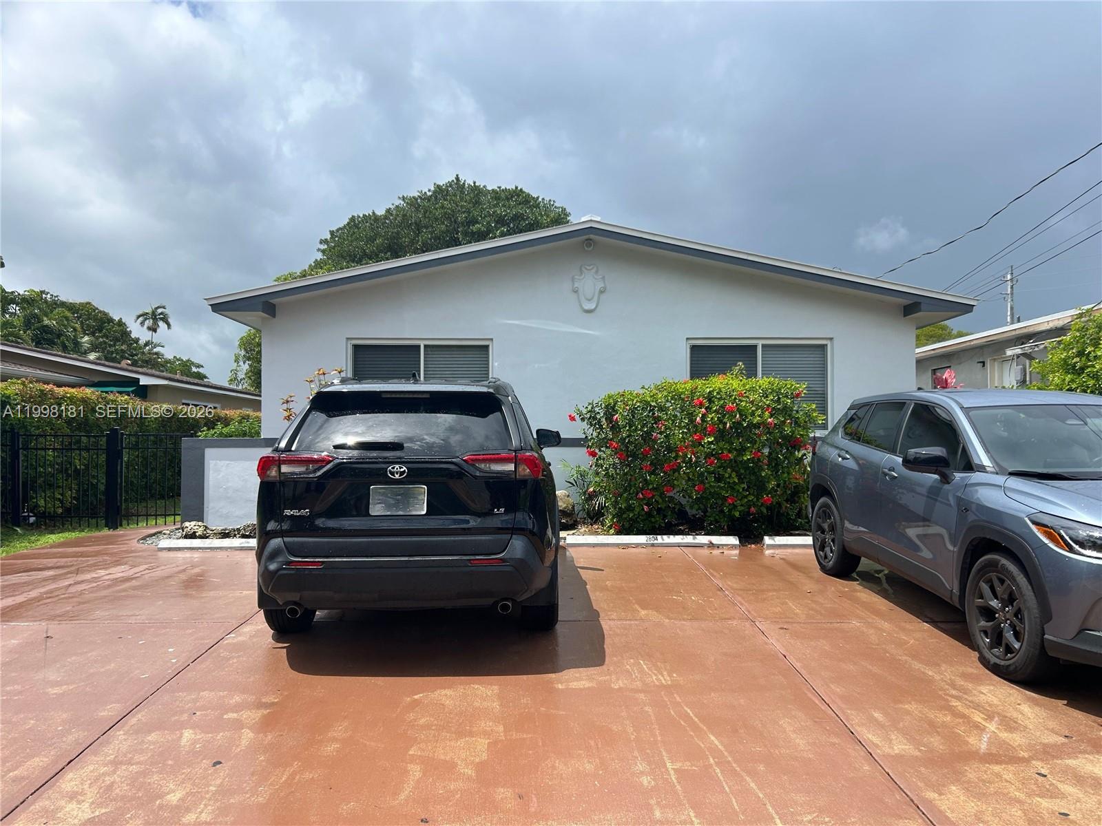 2804 Southwest 35th Avenue, Unit 2804 Miami, FL 33133 - Photo 22 of 22 a car parked in front of a house