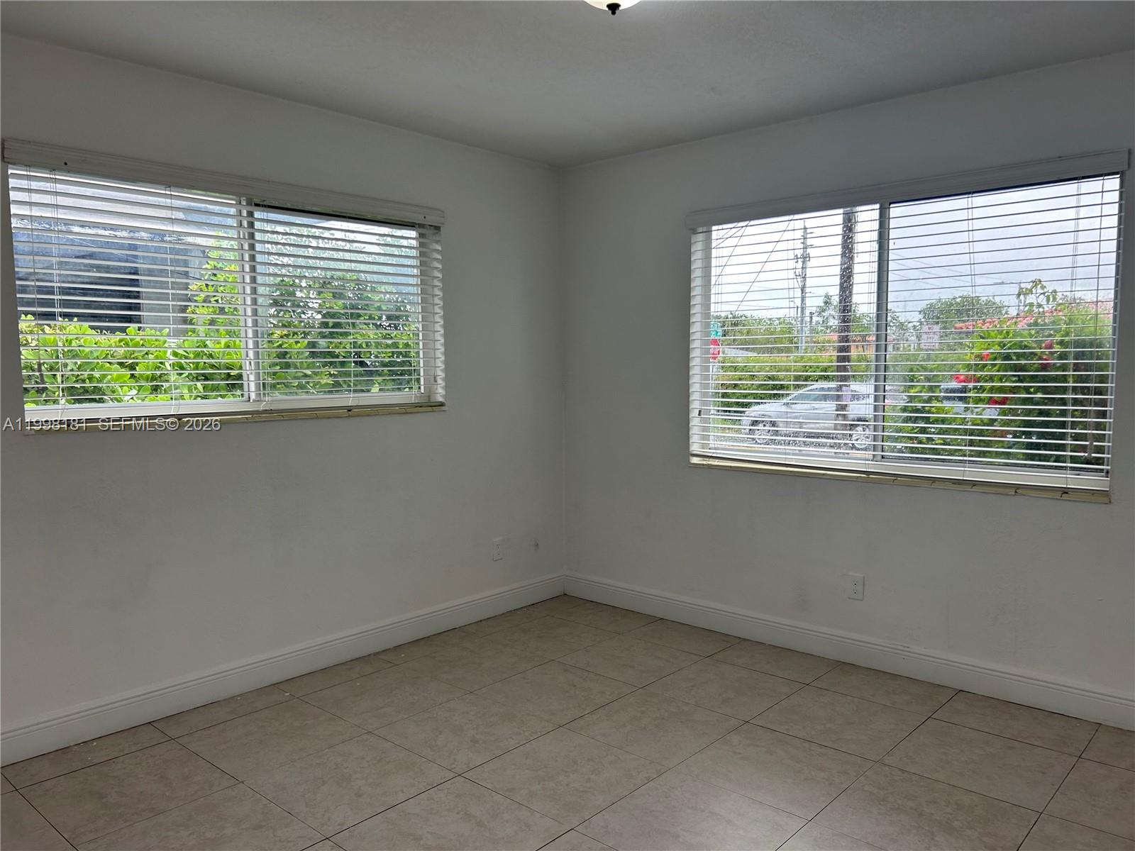 2804 Southwest 35th Avenue, Unit 2804 Miami, FL 33133 - Photo 9 of 22 a view of an empty room with a window