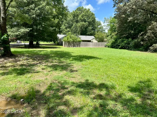 a view of a house with a big yard