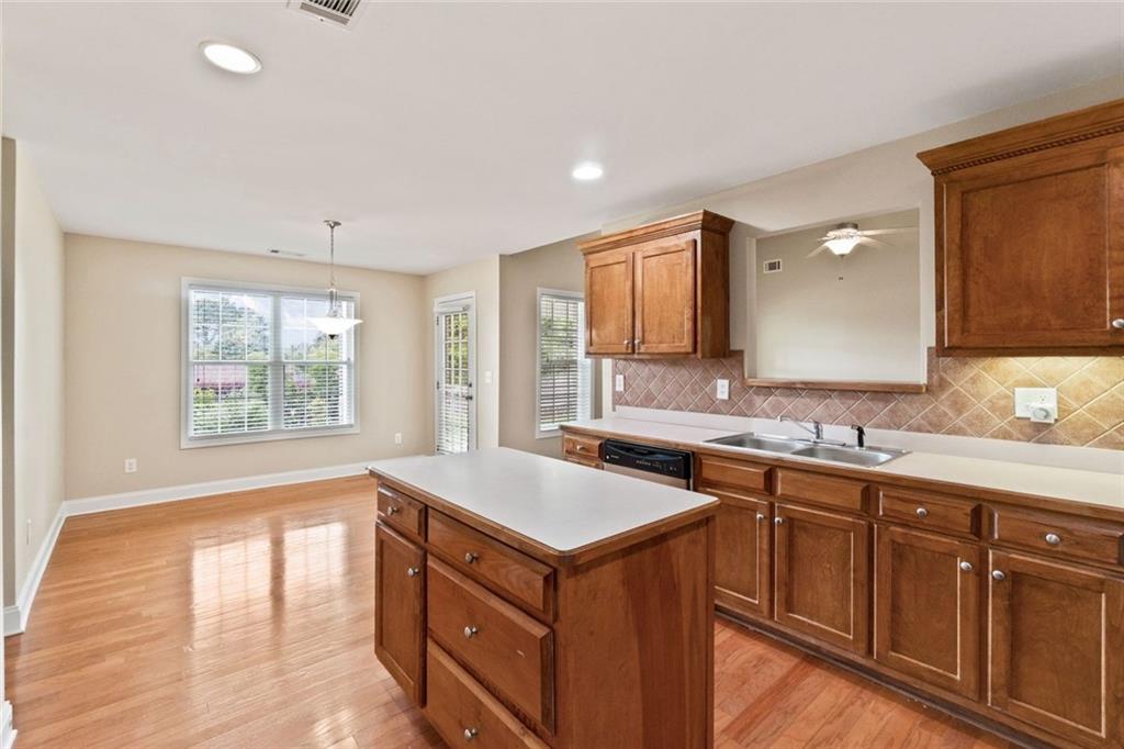 241 Red Bud Road Jefferson, GA 30549 - Photo 23 of 43 a kitchen with a sink stove and cabinets