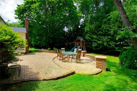 a view of a backyard with sitting area