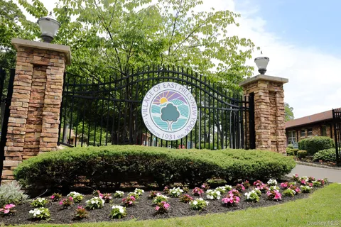 a view of a house with a backyard and garden