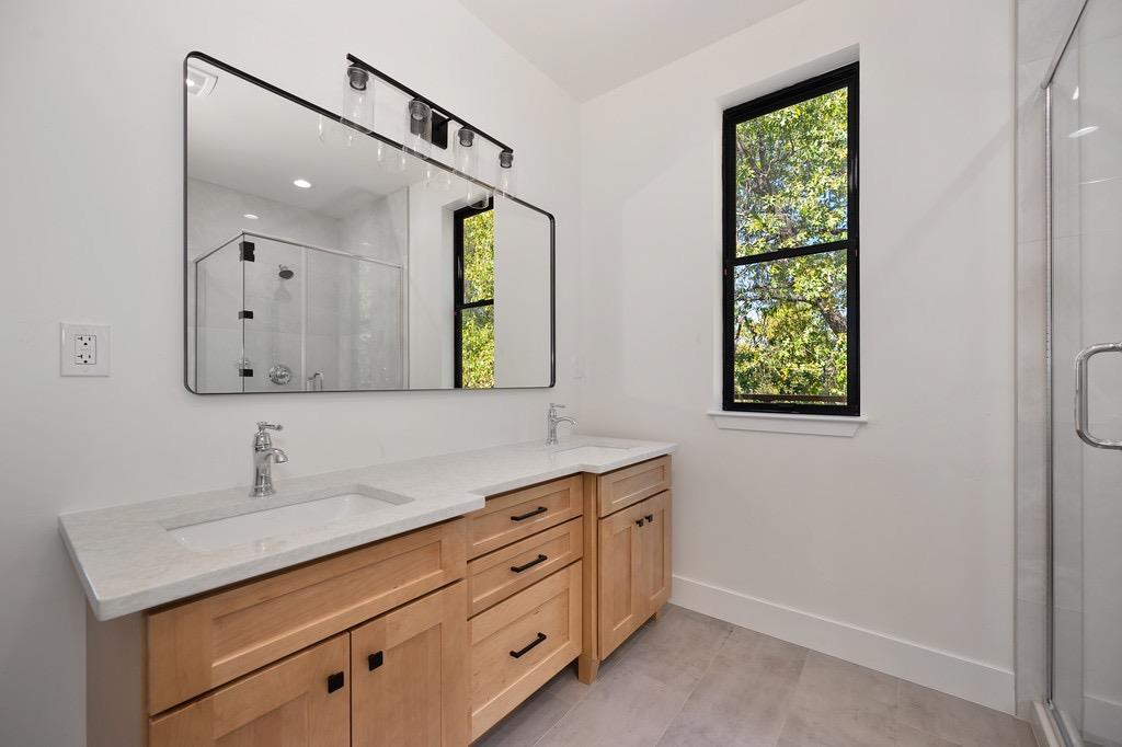 5205 Rooster Lane Somerset, CA 95684 - Photo 14 of 98 a bathroom with a sink and a mirror