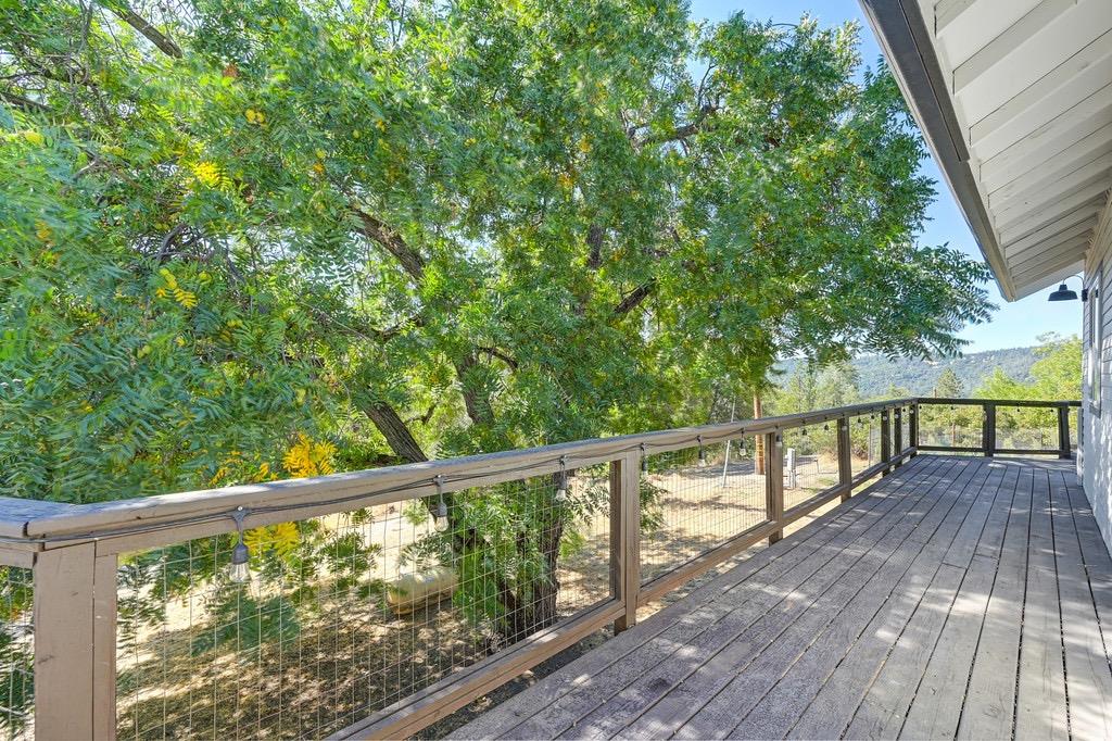 5205 Rooster Lane Somerset, CA 95684 - Photo 25 of 98 a view of balcony with wooden floor