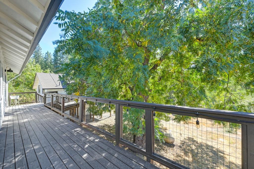 5205 Rooster Lane Somerset, CA 95684 - Photo 29 of 98 a view of balcony with wooden floor and fence