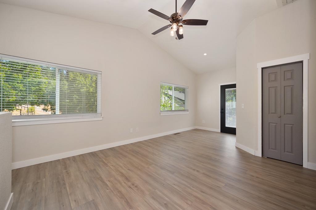 5205 Rooster Lane Somerset, CA 95684 - Photo 34 of 98 a view of empty room with wooden floor and fan