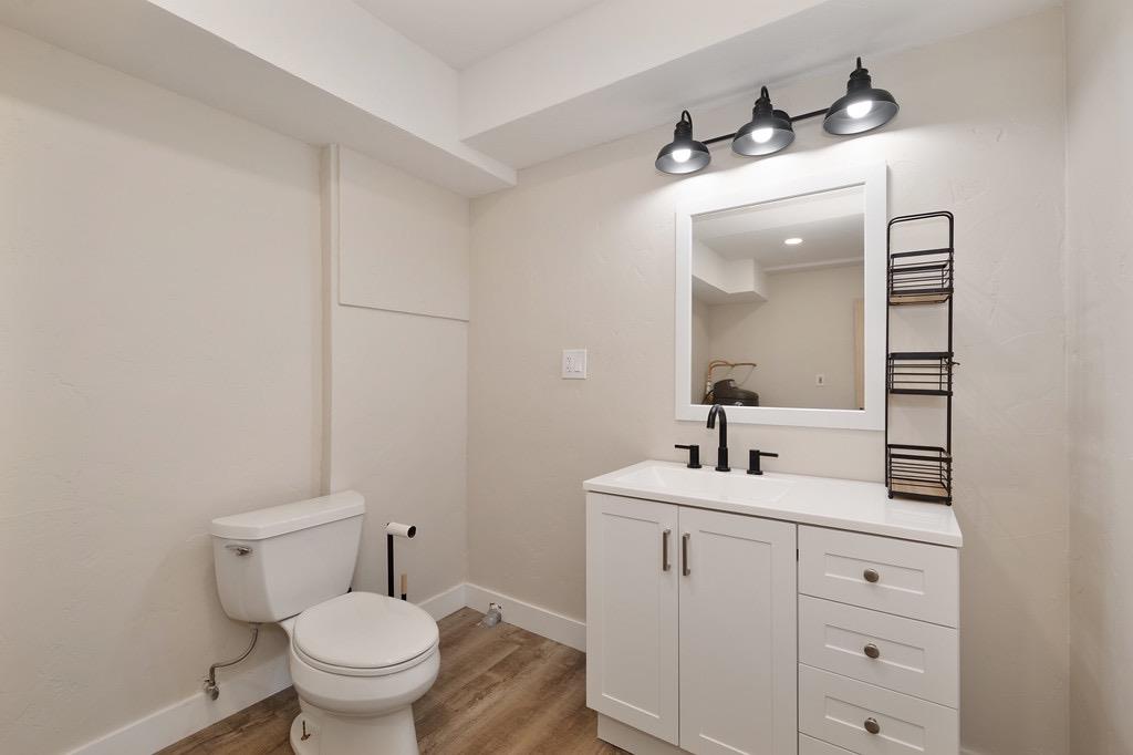 5205 Rooster Lane Somerset, CA 95684 - Photo 41 of 98 a bathroom with a toilet sink and mirror