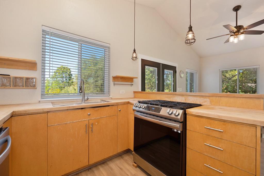 5205 Rooster Lane Somerset, CA 95684 - Photo 49 of 98 a kitchen with a stove a sink and a window